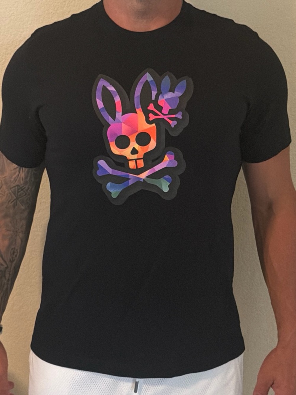 Psycho Bunny Black Tee with Vibrant Gradient Skull-Bunny Graphic
